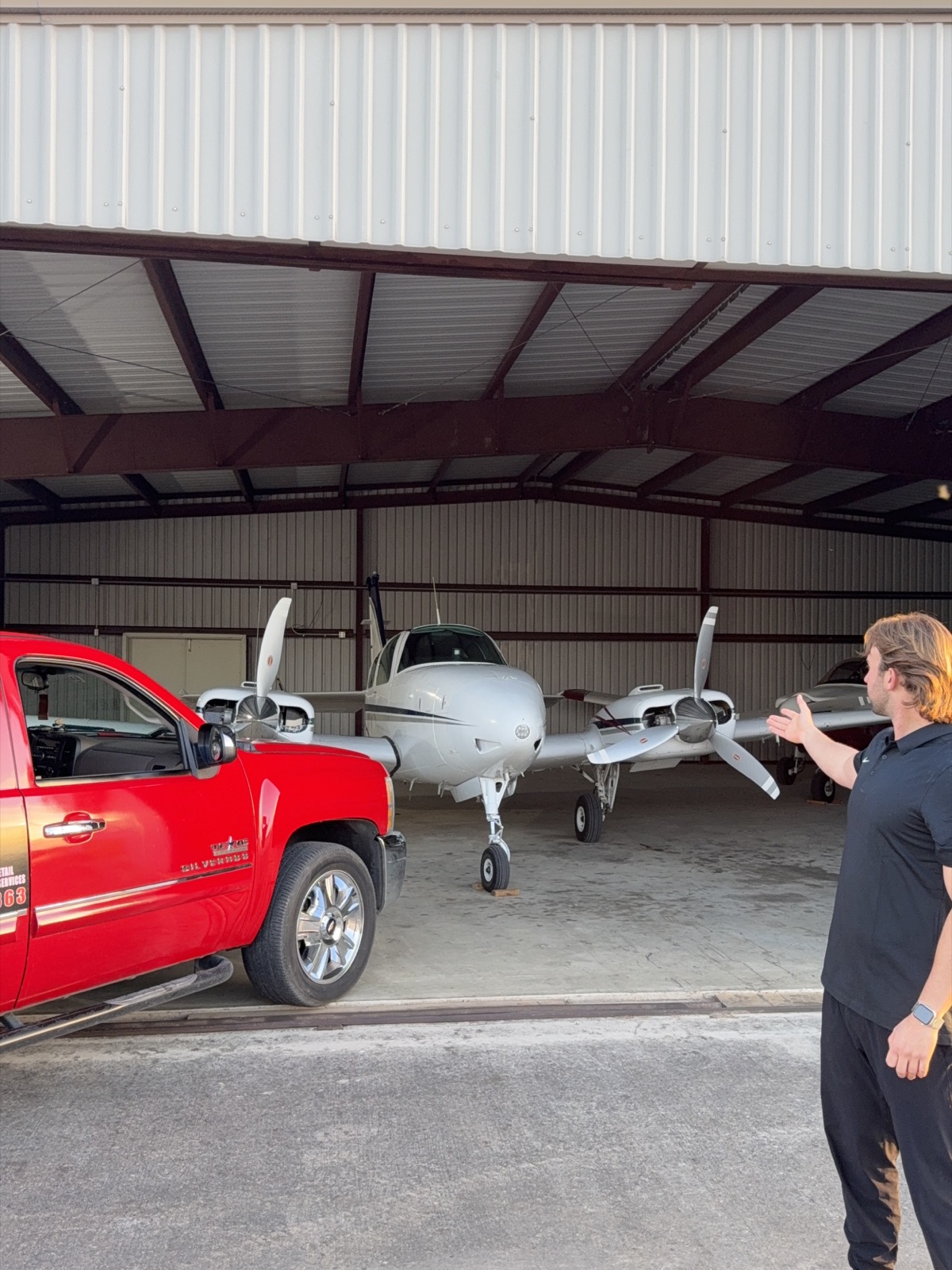 Spade Detail Co truck beside aircraft for aviation detailing service in Central Texas